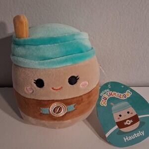 Squishmallow Hautely Latte plushie with teal blue hat and brown body